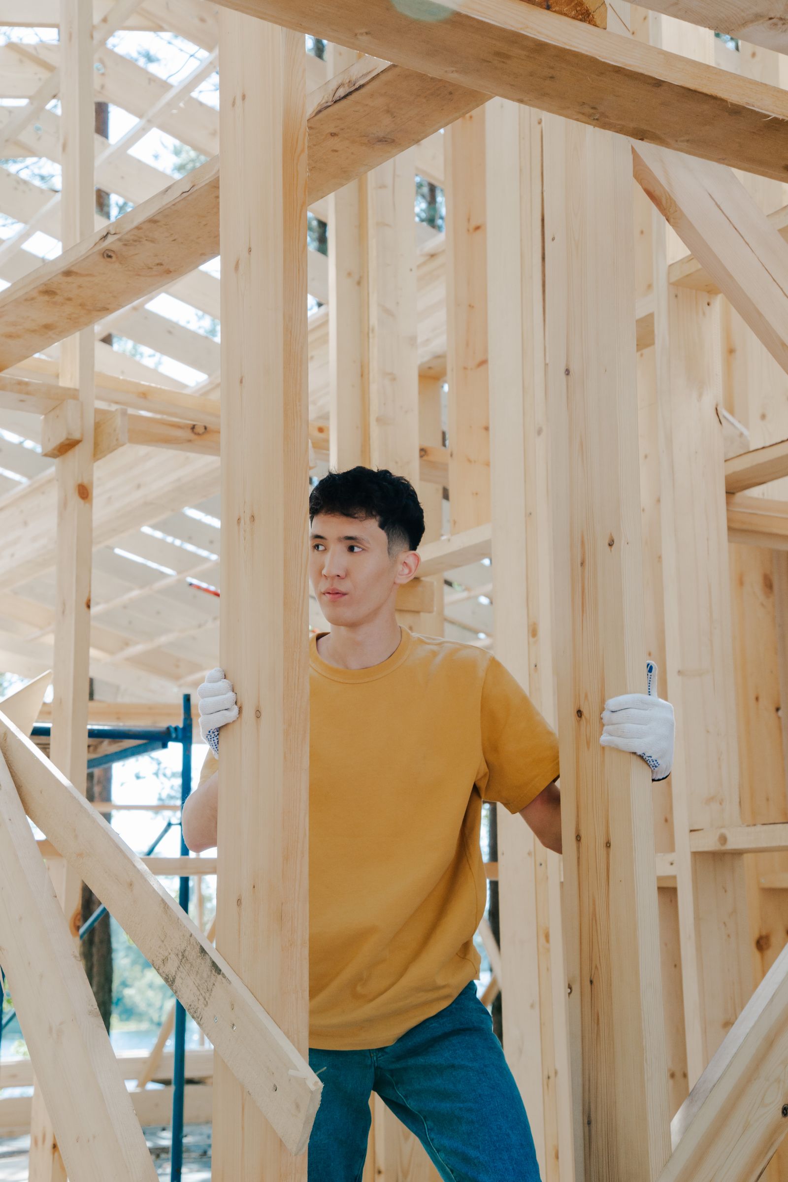 A contractor framing a wall on a residential remodel